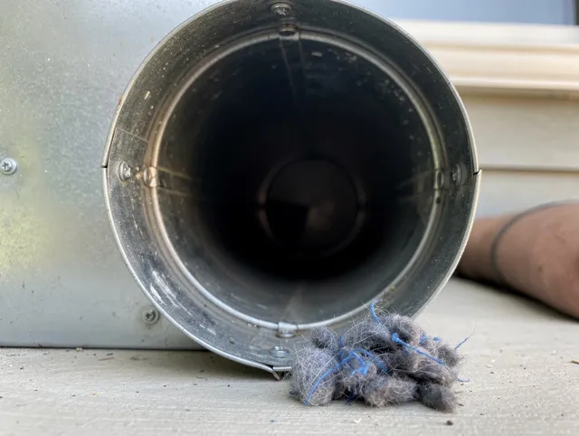 Placentia Dryer Vent Cleaning technician using specialized equipment to clear severe dryer vent blockage in Placentia
